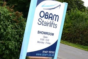 Photograph of the sign outside Obam Stairlifts showroom