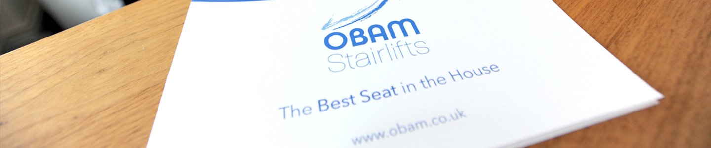 Image showing an Obam stairlifts catalogue on a desk