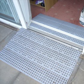 Picture of modular plastic ramps system over a upvc door threshold - Threshold Ramps