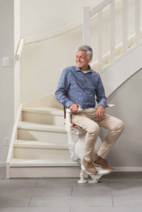 Picture of man about to use the otolift Air curved stairlift