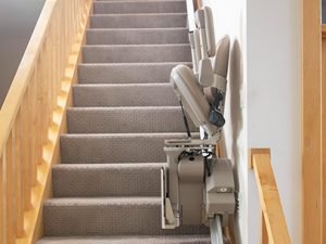 Picture of Bruno Elite folded on the stairs demonstrating plenty of room for other stair users