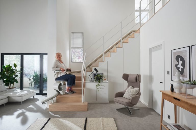 Picture of lady using Flow X Stairlift