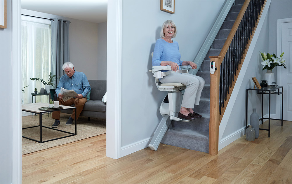 Smiling Woman on Straight Stairlift
