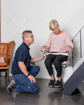 man helping women with her new stairlift