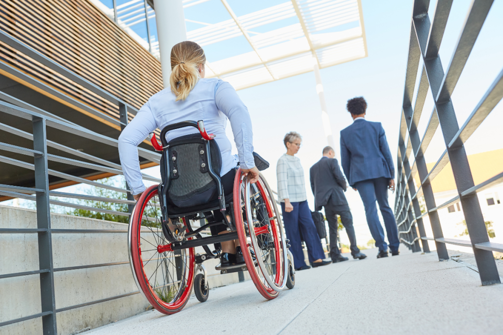 women using wheelchair on disabled ramp