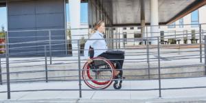 Women Using Wheelchair On Wheelchair Ramp