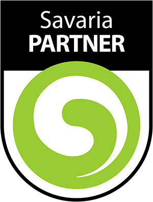 A badge with the text "Savaria PARTNER" above a green and white circular swirl logo on a black and white shield background.